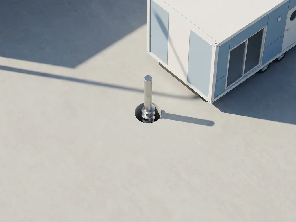 Stalen schroeffundatie paal naast modern mobiel huis model op betonnen ondergrond met geometrische schaduwen